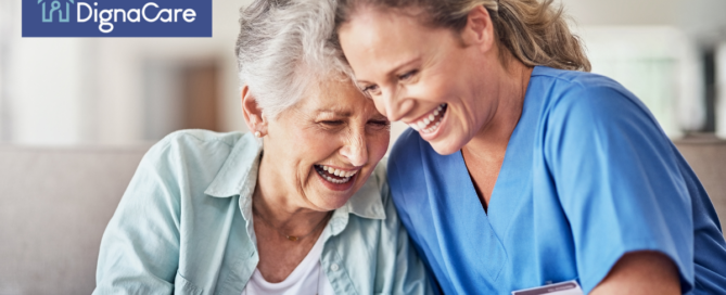 A woman who is providing companion care and her senior client laugh and enjoy their time together.