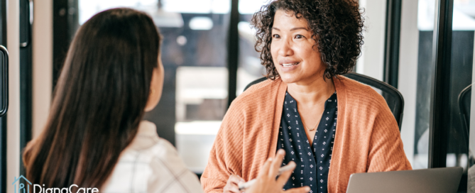 A woman interviews another woman for a caregiver job position.