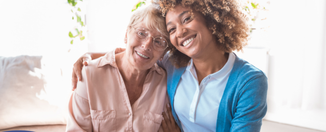 A caregiver enjoys professional caregiving as she helps a senior client.