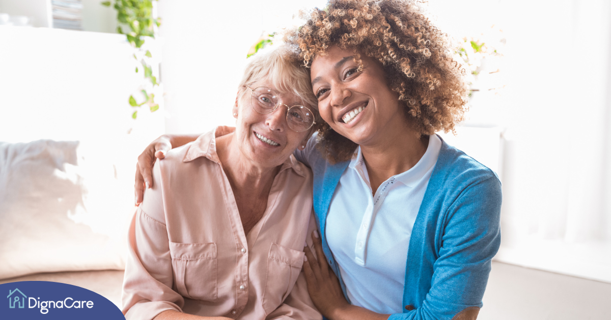 A caregiver enjoys professional caregiving as she helps a senior client.